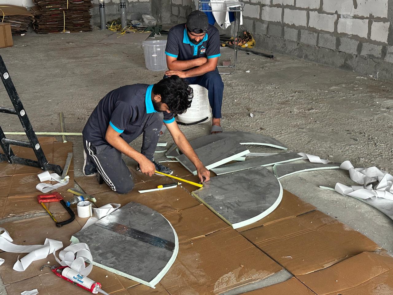Rapid Home technicians fabricating insulated duct sections