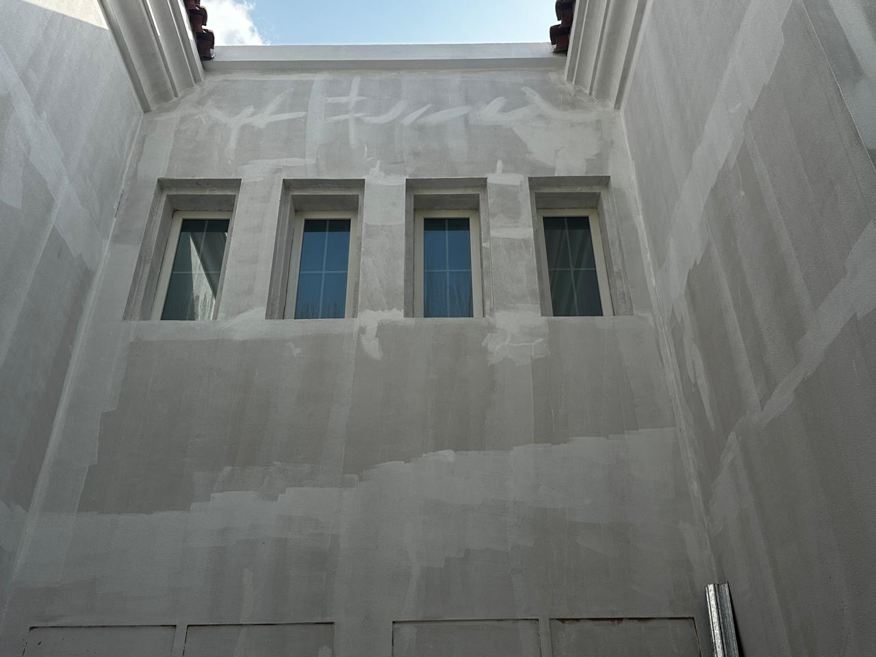 Villa walls prepared before exterior coating