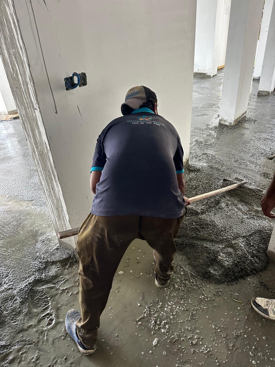 Rapid Home team placing and levelling floor screed