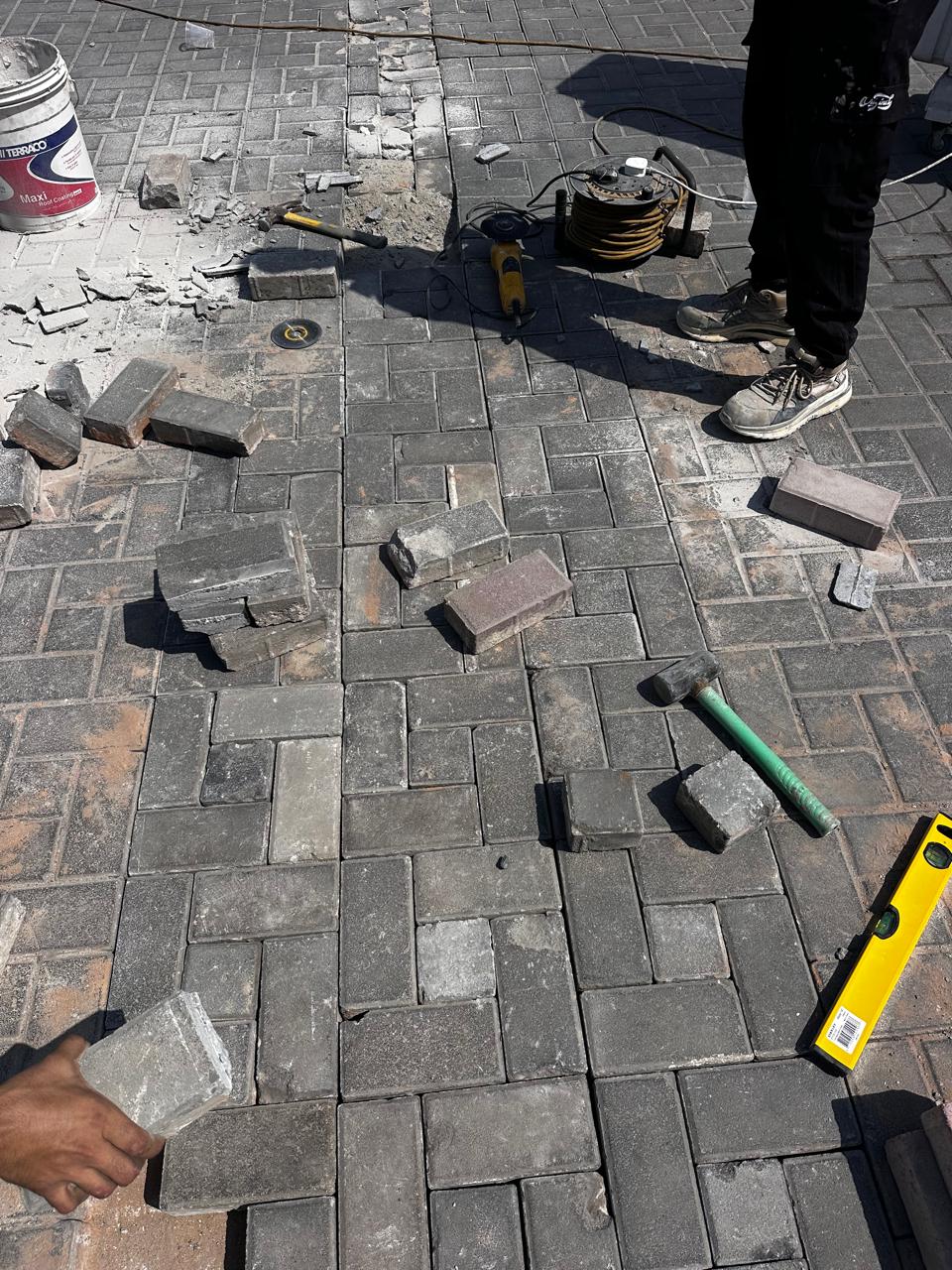 Interlock paving repair in progress at a Dubai villa