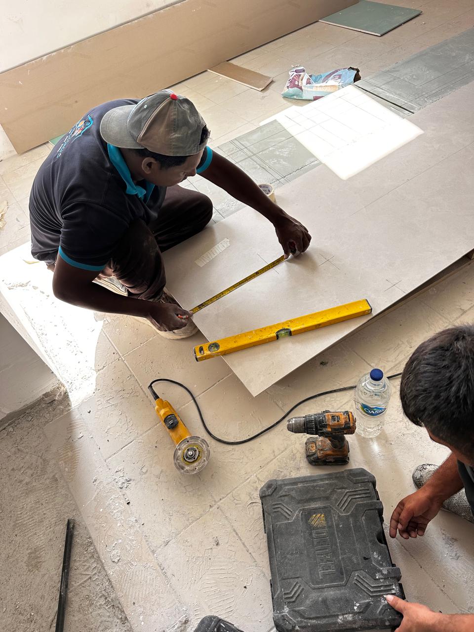 Rapid Home technician measuring a large-format tile