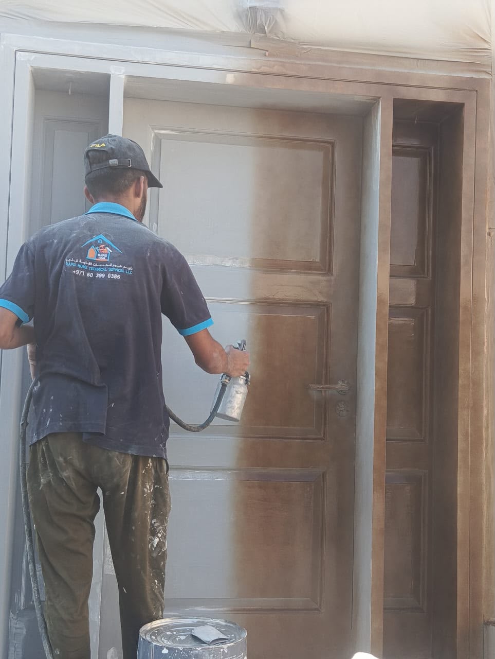 Rapid Home technician refinishing a panelled door